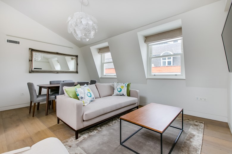 An airy living room, filled with natural light and lovely decor